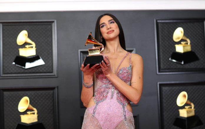 Dua Lipa with her Grammy for Best Pop Vocal Album in 2021.