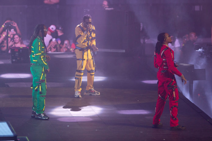 Migos—Takeoff, Offset, and Quavo—in concert in 2018.
