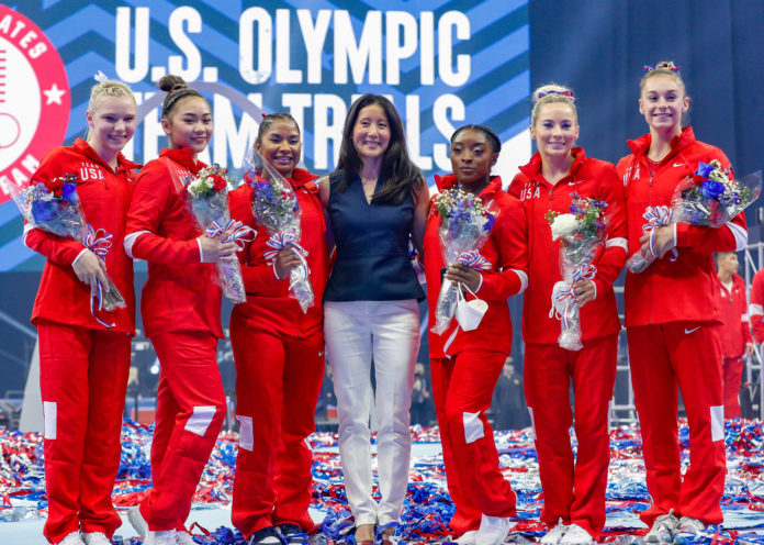 U.S. Olympians Jade Carey, Sunisa Lee, Jordan Childs, Simone Biles, MyKayla Skinner, and Grace McCallum pose with USAG President Li Li Leung at the U.S. Women's Gymnastics Trails in June 2021.