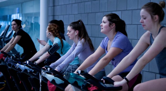 Women cycling at the gym