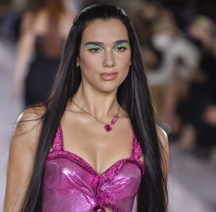 Dua Lipa on the catwalk at the Versace show at Spring Summer 2022 Milan Fashion Week.